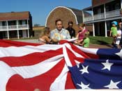 Gene Pisasale rasing the flag at Fort McHenry